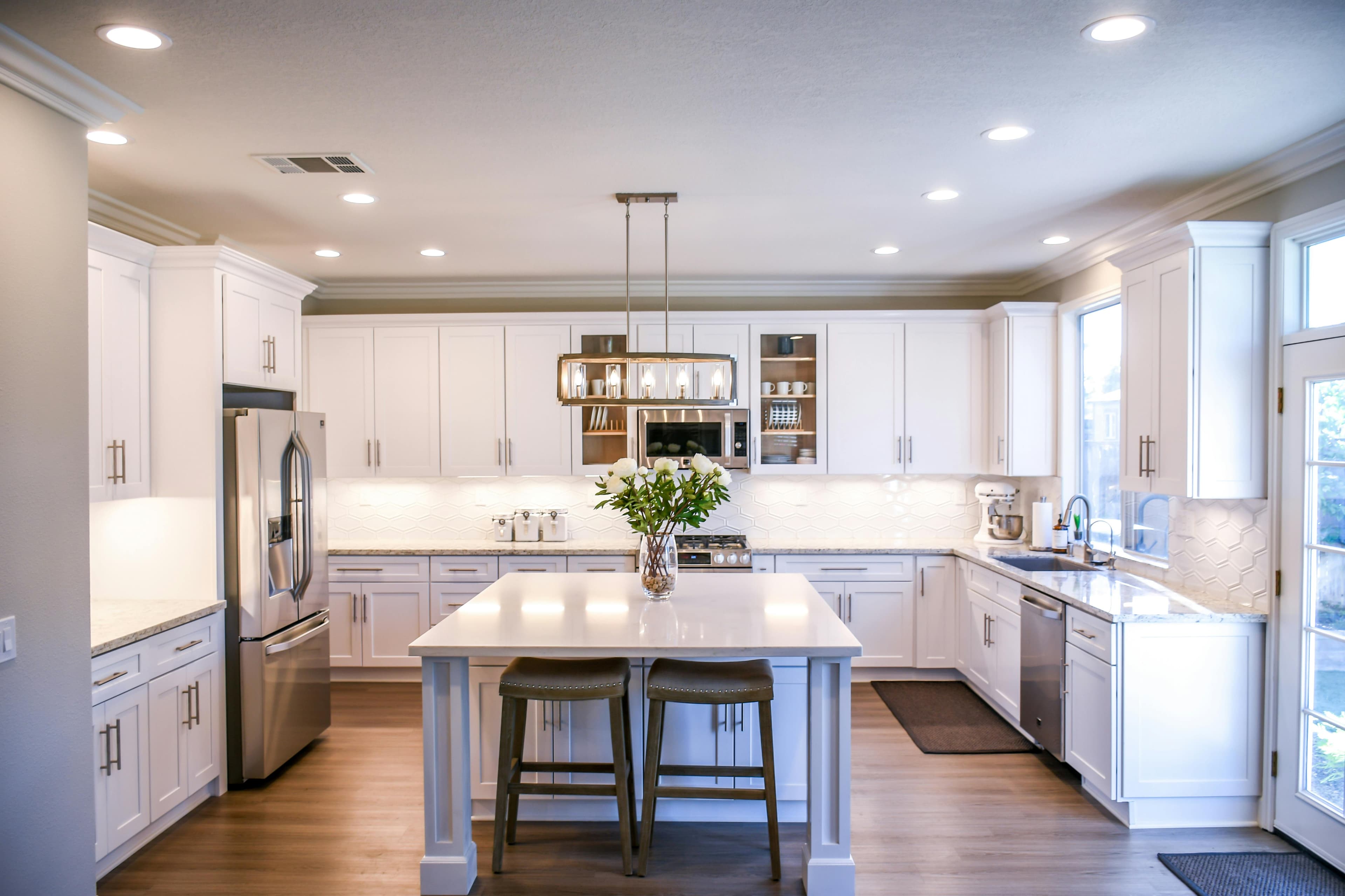 Clean white wooden cupboards in a modern kitchen